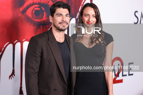 Raul Castillo and Alexis Forte arrive at the Global Premiere Of Paramount Pictures' 'Smile 2' held at Paramount Pictures Studios on October...