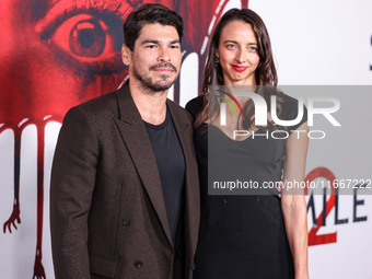 Raul Castillo and Alexis Forte arrive at the Global Premiere Of Paramount Pictures' 'Smile 2' held at Paramount Pictures Studios on October...