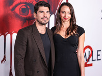 Raul Castillo and Alexis Forte arrive at the Global Premiere Of Paramount Pictures' 'Smile 2' held at Paramount Pictures Studios on October...