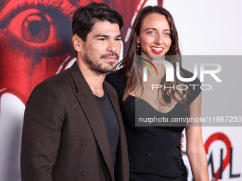 Raul Castillo and Alexis Forte arrive at the Global Premiere Of Paramount Pictures' 'Smile 2' held at Paramount Pictures Studios on October...