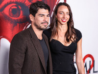 Raul Castillo and Alexis Forte arrive at the Global Premiere Of Paramount Pictures' 'Smile 2' held at Paramount Pictures Studios on October...