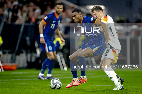 Netherlands midfielder Ryan Gravenberch and Germany midfielder Angelo Stiller play during the match between Germany and the Netherlands at t...