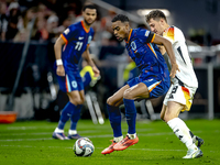 Netherlands midfielder Ryan Gravenberch and Germany midfielder Angelo Stiller play during the match between Germany and the Netherlands at t...