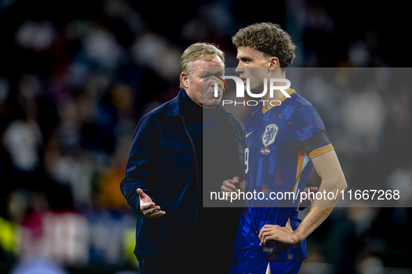 Netherlands trainer Ronald Koeman and Netherlands midfielder Mats Wieffer participate during the match between Germany and the Netherlands a...