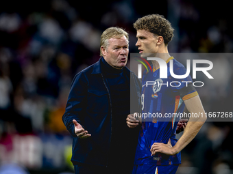 Netherlands trainer Ronald Koeman and Netherlands midfielder Mats Wieffer participate during the match between Germany and the Netherlands a...