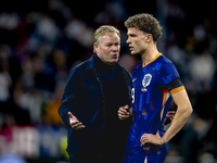 Netherlands trainer Ronald Koeman and Netherlands midfielder Mats Wieffer participate during the match between Germany and the Netherlands a...