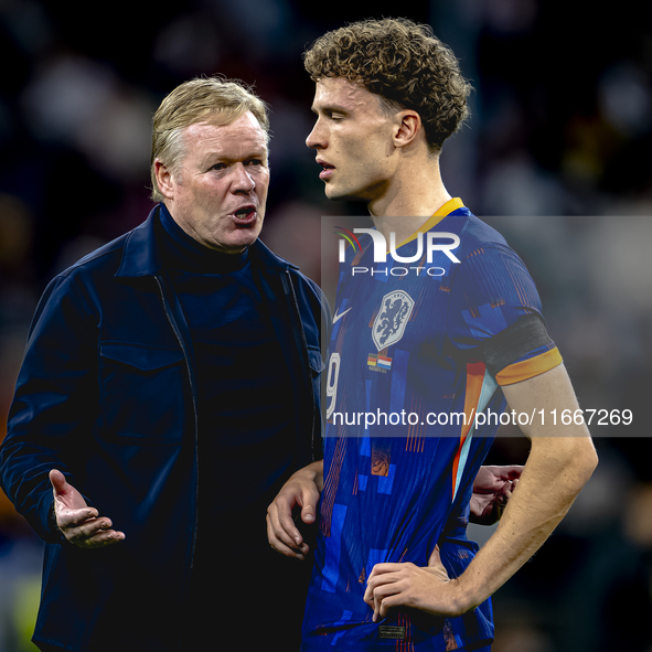 Netherlands trainer Ronald Koeman and Netherlands midfielder Mats Wieffer participate during the match between Germany and the Netherlands a...