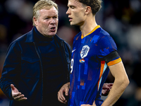 Netherlands trainer Ronald Koeman and Netherlands midfielder Mats Wieffer participate during the match between Germany and the Netherlands a...