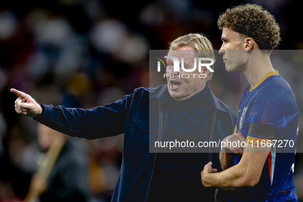 Netherlands trainer Ronald Koeman and Netherlands midfielder Mats Wieffer participate during the match between Germany and the Netherlands a...