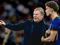 Netherlands trainer Ronald Koeman and Netherlands midfielder Mats Wieffer participate during the match between Germany and the Netherlands a...