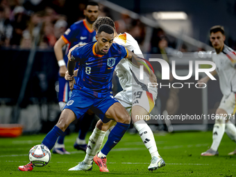 Netherlands midfielder Ryan Gravenberch and Germany midfielder Angelo Stiller play during the match between Germany and the Netherlands at t...