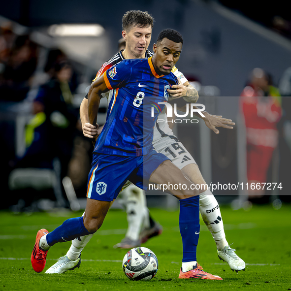 Netherlands midfielder Ryan Gravenberch and Germany midfielder Angelo Stiller play during the match between Germany and the Netherlands at t...