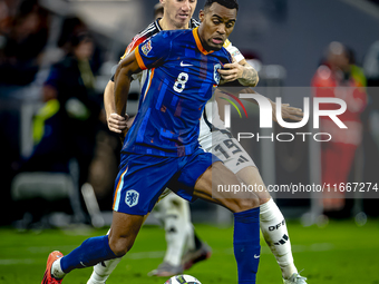 Netherlands midfielder Ryan Gravenberch and Germany midfielder Angelo Stiller play during the match between Germany and the Netherlands at t...