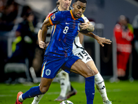 Netherlands midfielder Ryan Gravenberch and Germany midfielder Angelo Stiller play during the match between Germany and the Netherlands at t...