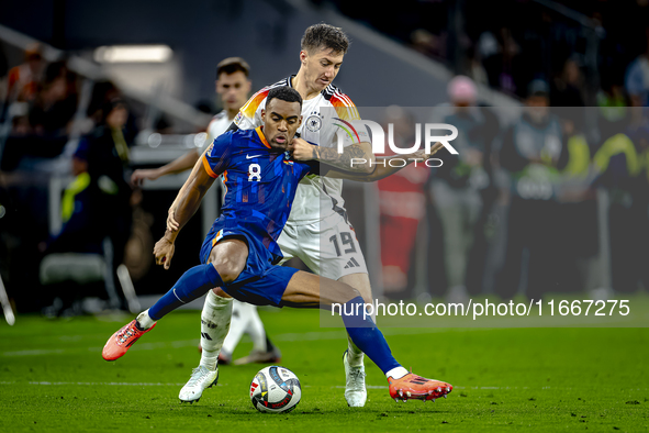 Netherlands midfielder Ryan Gravenberch and Germany midfielder Angelo Stiller play during the match between Germany and the Netherlands at t...