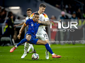 Netherlands midfielder Ryan Gravenberch and Germany midfielder Angelo Stiller play during the match between Germany and the Netherlands at t...