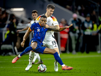 Netherlands midfielder Ryan Gravenberch and Germany midfielder Angelo Stiller play during the match between Germany and the Netherlands at t...