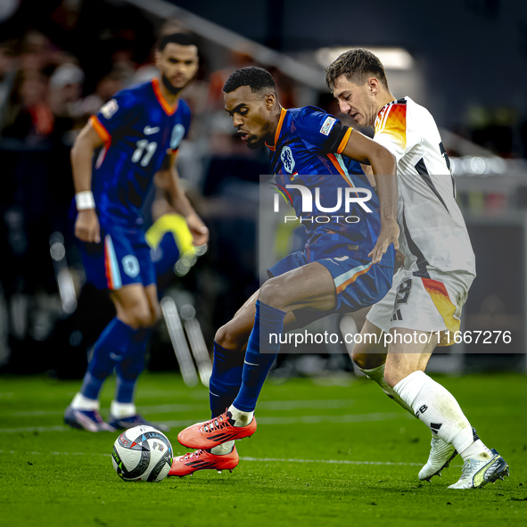 Netherlands midfielder Ryan Gravenberch and Germany midfielder Angelo Stiller play during the match between Germany and the Netherlands at t...