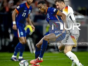 Netherlands midfielder Ryan Gravenberch and Germany midfielder Angelo Stiller play during the match between Germany and the Netherlands at t...