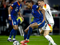 Netherlands midfielder Ryan Gravenberch and Germany midfielder Angelo Stiller play during the match between Germany and the Netherlands at t...