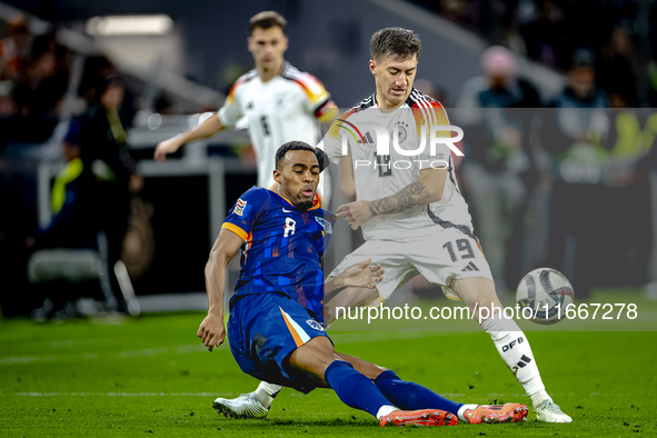 Netherlands midfielder Ryan Gravenberch and Germany midfielder Angelo Stiller play during the match between Germany and the Netherlands at t...