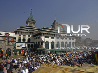 People offer congregational prayers during the annual festival of Saint Sheikh Abdul Qadir Jeelani (RA) in Srinagar, Kashmir, on October 15,...