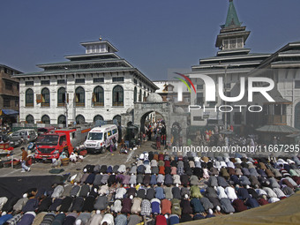 People offer congregational prayers during the annual festival of Saint Sheikh Abdul Qadir Jeelani (RA) in Srinagar, Kashmir, on October 15,...