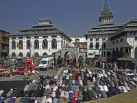 People offer congregational prayers during the annual festival of Saint Sheikh Abdul Qadir Jeelani (RA) in Srinagar, Kashmir, on October 15,...