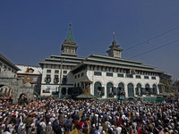 People pray as the head cleric (not in picture) displays the holy relic during the festival of Sufi Saint Sheikh Abdul Qadir Jeelani (RA) in...