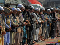 People offer congregational prayers during the annual festival of Saint Sheikh Abdul Qadir Jeelani (RA) in Srinagar, Kashmir, on October 15,...