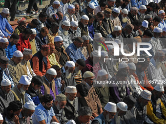 People offer congregational prayers during the annual festival of Saint Sheikh Abdul Qadir Jeelani (RA) in Srinagar, Kashmir, on October 15,...