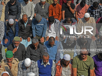 People offer congregational prayers during the annual festival of Saint Sheikh Abdul Qadir Jeelani (RA) in Srinagar, Kashmir, on October 15,...