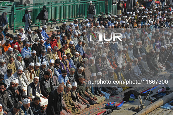 People offer congregational prayers during the annual festival of Saint Sheikh Abdul Qadir Jeelani (RA) in Srinagar, Kashmir, on October 15,...