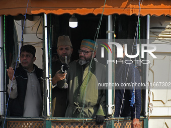 The head cleric displays the holy relic during the festival of Saint Sheikh Abdul Qadir Jeelani (RA) in Srinagar, Kashmir, on October 15, 20...