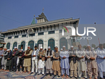 People offer congregational prayers during the annual festival of Saint Sheikh Abdul Qadir Jeelani (RA) in Srinagar, Kashmir, on October 15,...