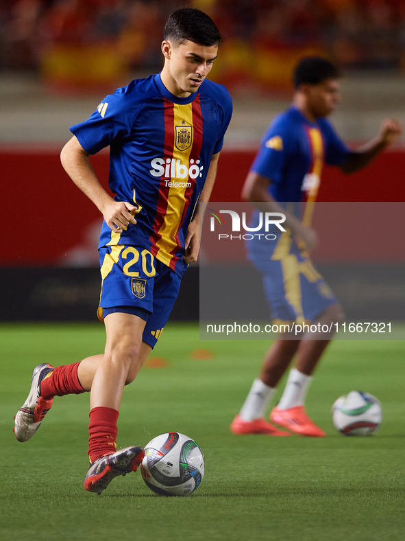 Pedri of Spain is in action before the UEFA Nations League 2024/25 League A Group A4 game between Spain and Denmark at Enrique Roca Stadium...