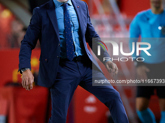 Luis de la Fuente, head coach of Spain, stops the ball during the UEFA Nations League 2024/25 League A Group A4 game between Spain and Denma...