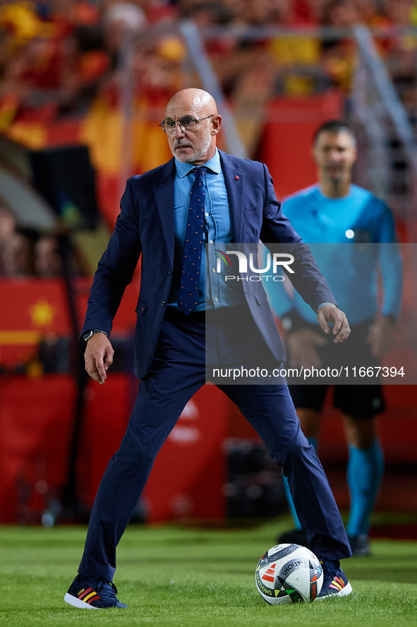 Luis de la Fuente, head coach of Spain, stops the ball during the UEFA Nations League 2024/25 League A Group A4 game between Spain and Denma...