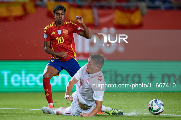 Lamine Yamal of Spain competes for the ball with Vestergaard of Denmark during the UEFA Nations League 2024/25 League A Group A4 game betwee...