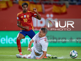 Lamine Yamal of Spain competes for the ball with Vestergaard of Denmark during the UEFA Nations League 2024/25 League A Group A4 game betwee...