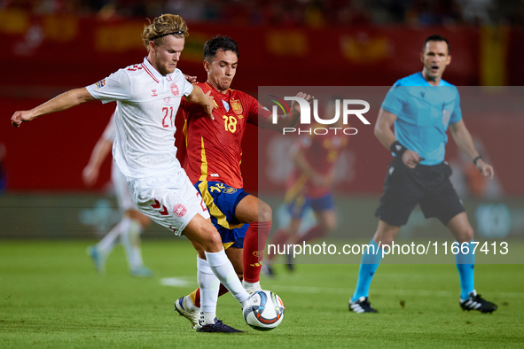 Martin Zubimendi of Spain competes for the ball with Hjulmand of Denmark during the UEFA Nations League 2024/25 League A Group A4 game betwe...