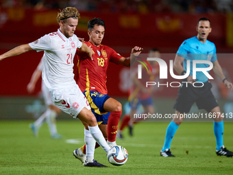 Martin Zubimendi of Spain competes for the ball with Hjulmand of Denmark during the UEFA Nations League 2024/25 League A Group A4 game betwe...