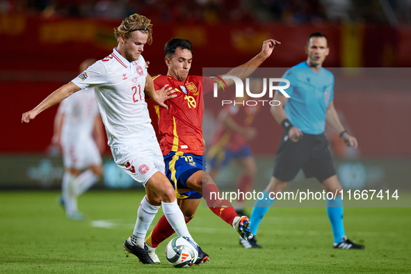 Martin Zubimendi of Spain competes for the ball with Hjulmand of Denmark during the UEFA Nations League 2024/25 League A Group A4 game betwe...