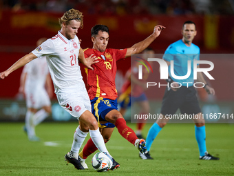 Martin Zubimendi of Spain competes for the ball with Hjulmand of Denmark during the UEFA Nations League 2024/25 League A Group A4 game betwe...