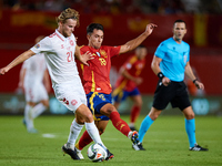 Martin Zubimendi of Spain competes for the ball with Hjulmand of Denmark during the UEFA Nations League 2024/25 League A Group A4 game betwe...