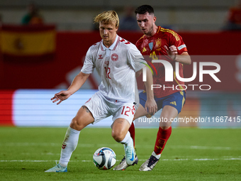 Dolberg of Denmark competes for the ball with Aymeric Laporte of Spain during the UEFA Nations League 2024/25 League A Group A4 game between...