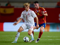 Dolberg of Denmark competes for the ball with Aymeric Laporte of Spain during the UEFA Nations League 2024/25 League A Group A4 game between...