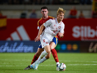 Dolberg (R) of Denmark competes for the ball with Aymeric Laporte of Spain during the UEFA Nations League 2024/25 League A Group A4 game bet...