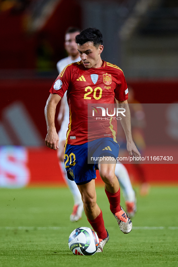 Pedri of Spain is in action during the UEFA Nations League 2024/25 League A Group A4 game between Spain and Denmark at Enrique Roca Stadium...