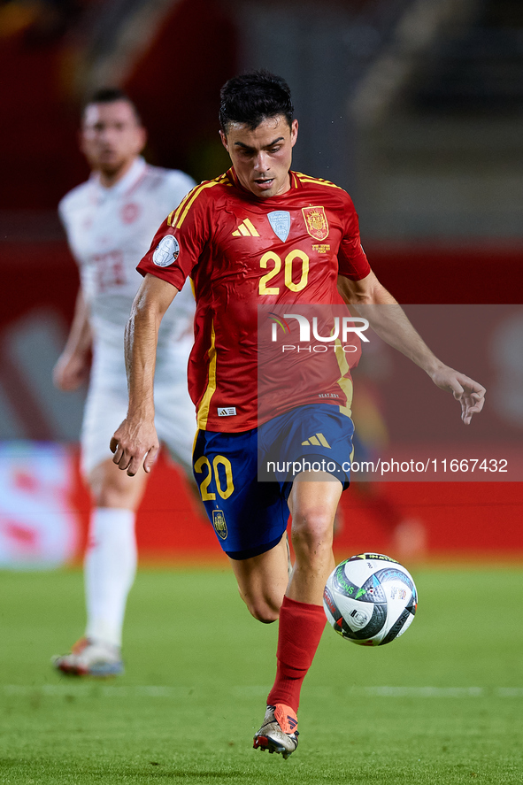 Pedri of Spain is in action during the UEFA Nations League 2024/25 League A Group A4 game between Spain and Denmark at Enrique Roca Stadium...